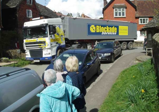 Lorry stuck in the centre of West Hoathly SUS-160519-144926001