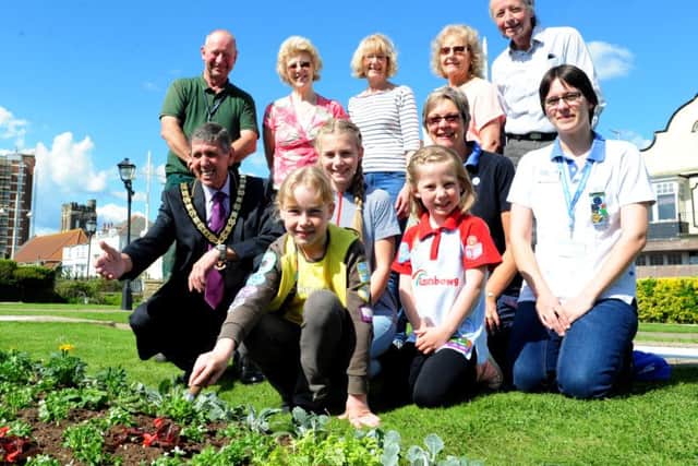 The finalists are joined by the In Bloom Working Party at the mini golf course, where Ella's design has been planted ks16000659-3