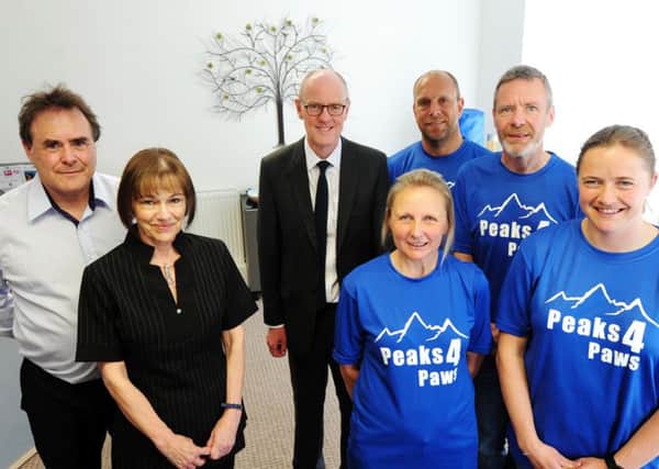 The Tone Zones runners (in blue), MP Nick Gibb (centre) and staff at Mirage, where an open day will be held