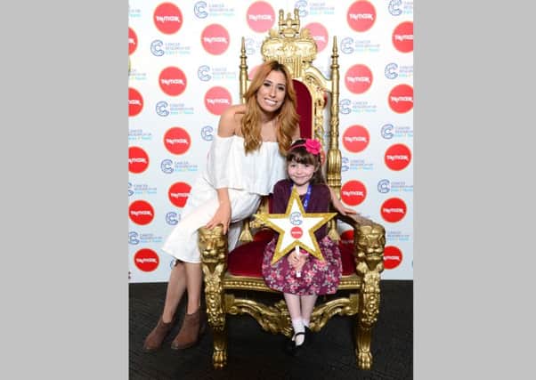 Stacey Solomon meets brave Ellie Mae Wile-Dunne at the circus themed Cancer Research UK Kids & Teens Star Awards party, held in partnership with TK Maxx, at The Roof Gardens, Kensington, The Star Awards celebrate all youngsters diagnosed with cancer who shine with courage. For more information visit cruk.org/kidsandteens