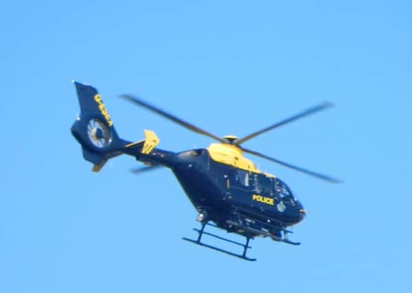 Police helicopter seen above Summerlea Community Primary School in Rustington. Picture: Aidan Skinner