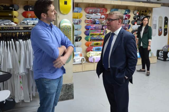 The Source Park co-founder Richard Moore in the skate park shop with communities minister Mark Francois. Photo by Sid Saunders