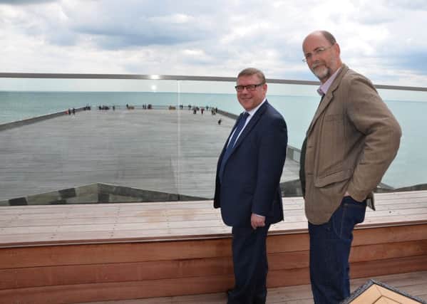 Mark Francois on the pier with the Hastings Pier Charity chief executive Simon Opie. Photo by Sid Saunders