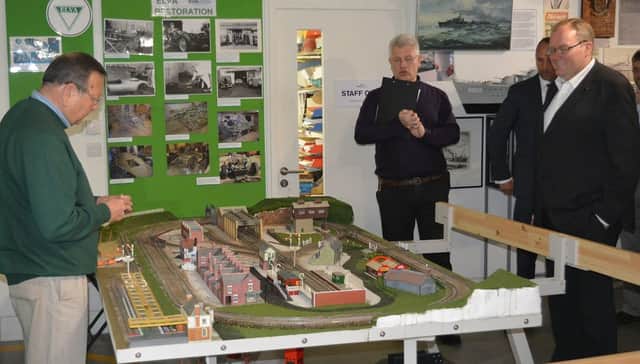 Ken Bywater shows Darren Henley, the chief executive of the Arts Council England, the Izzard family rail layout at Bexhill Museum. Also pictured is museum curator Julian Porter. SUS-160524-125239001