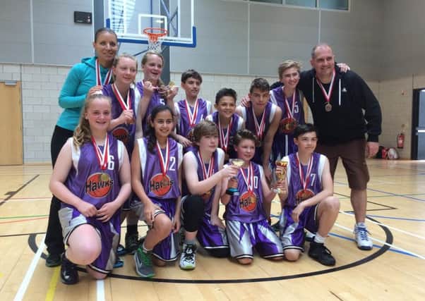 Horsham Hawks under-13s celebrate their 61-59 victory against Crawley Cagers which saw them lift the Sussex Cup