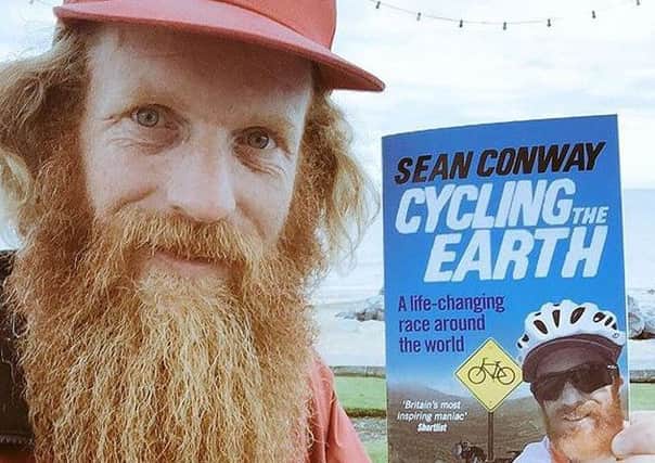 Sean Conway and his book about cycling the world.