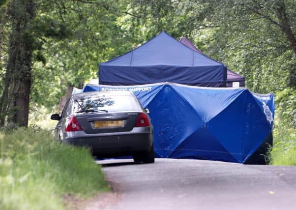 Forensics teams at the site where human remains have been found on Hampshire Hill in Slaugham. Picture: Eddie Mitchell