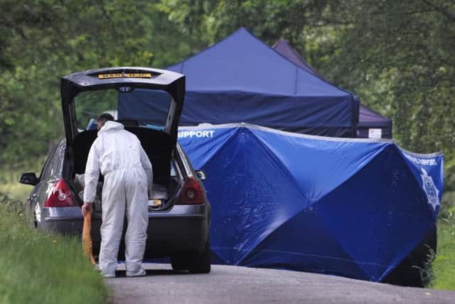 Forensics teams at the site where human remains were found on Hampshire Hill in Slaugham. Picture: Eddie Mitchell