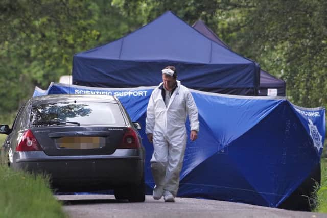 Forensics teams at the site where human remains were found on Hampshire Hill in Slaugham. Picture: Eddie Mitchell