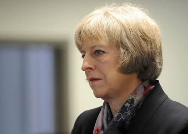 Home Secretary Theresa May, pictured earlier this year, announced plans to put PCCs in control of fire services last week