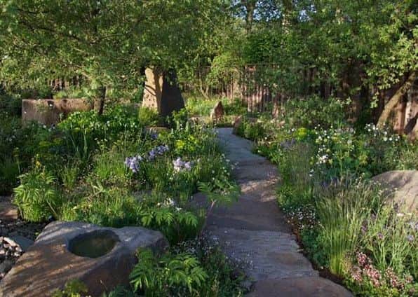 The award at the Chelsea Flower Show recognises the work of landscape artists.