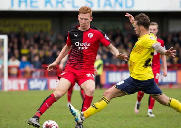 Josh Yorwerth takes the ball around an opposing player for Crawley Town against Oxford United, 9th April 2016. (c) Jack Beard SUS-160904-224141008