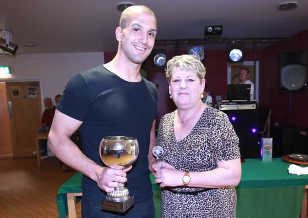 Sami El-Abd receives the 2015-16 Chairman's Cup from Sarah Warwick of the Rocks' supporters' club / Picture by Tim Hale