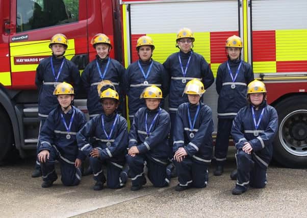 Oriel High School students celebrate finishing the FireBreak course with a passing out parade at Haywards Heath Fire Station - picture submitted by West Sussex Fire and Rescue