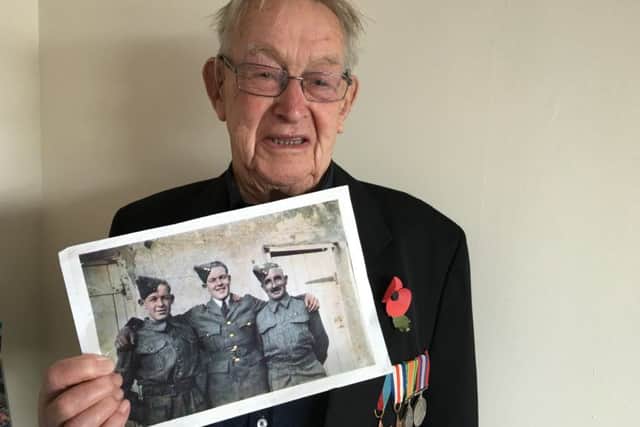 Jack Paige, who has lived in Bognor Regis his entire life, with a picture of one of his brothers and his father