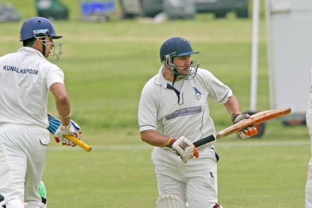 DM16121343a.jpg Cricket: Findon (Fielding) v Crawley. Kunal Kapoor left and Razwan. Photo by Derek Martin SUS-160406-230554008