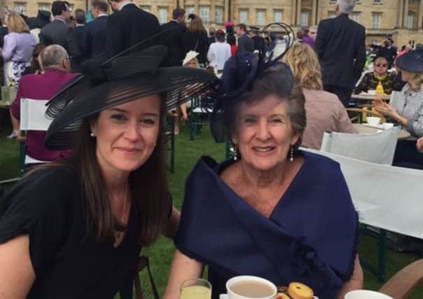 Jane and her daughter Lucy at Buckingham Palace.