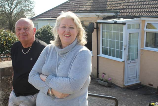 Roger outside his bungalow in Sompting with television presenter Lisa Holloway. Picture: Ricochet