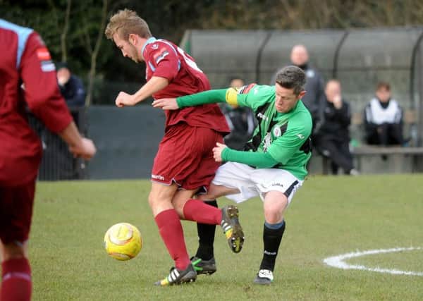 Darren Budd, in green, in action for Burgess Hill / Picture by Steve Robards