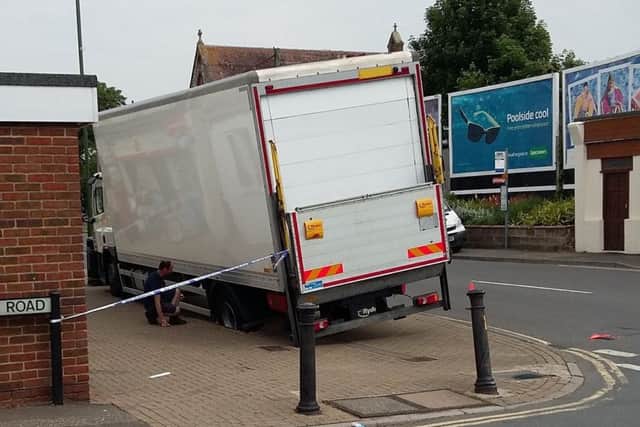 A lorry has become stranded after sinking into pavement in Wick