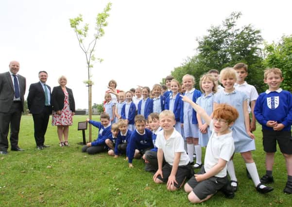 David Kempster, far left, and Will Stisted with head teacher Mandy Sadler and pupils. Picture: Derek Martin DM16122878a