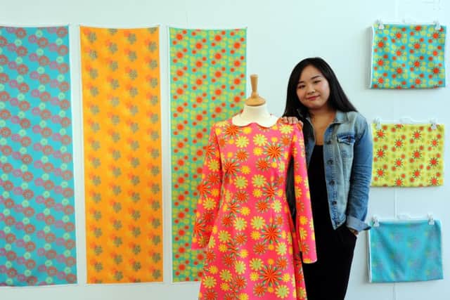 Karen Kong with her textile display entitled Bye Bye 1960s. Picture: Kate Shemilt ks16000743-4
