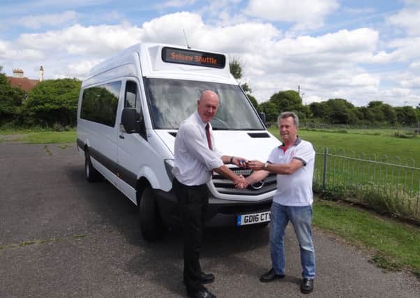 Selsey Shuttle Co-ordinator, Fred Basson, receives the keys to the new bus from Brian Eaton, Sales Manager of Euromotive (Kent) Ltd.
