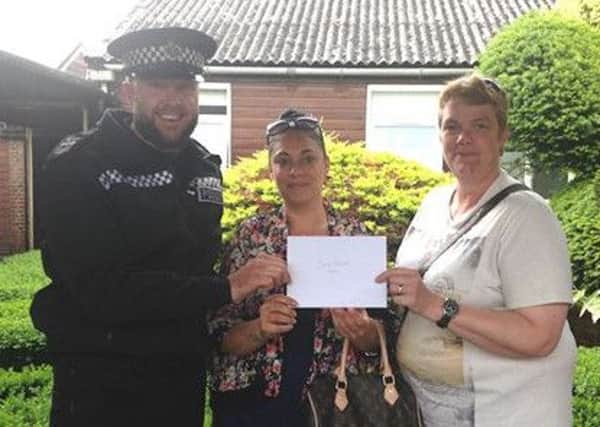 Police donation to new Stone Quarry Residents' Community Group in East Grinstead.