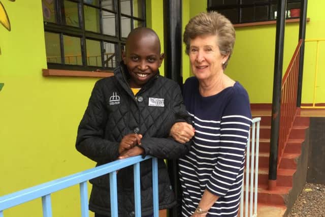 Jane and her sponsored child Simon at the school in Nairobi.