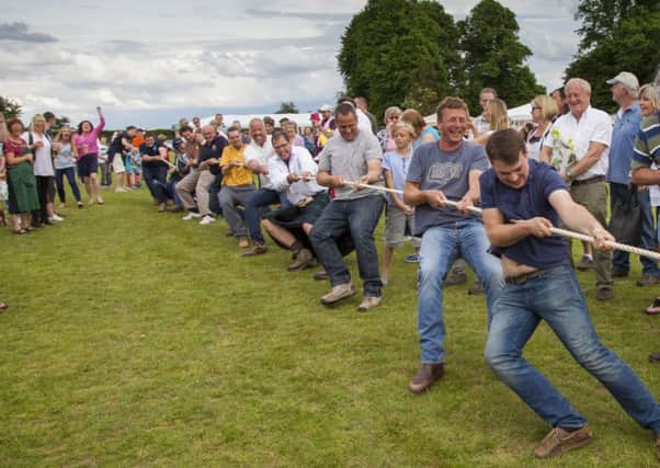 The tug of war was a fierce battle between farmers and footballers. Picture: Hamish McKay