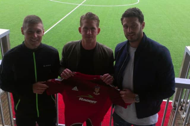 Sam Rents (middle) with Worthing joint managers Jon Meeney and Gary Elphick