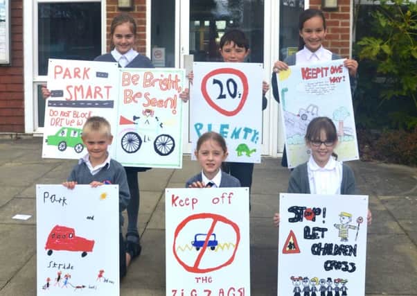 Pupils at Heron Way School, Horsham, are campaigning to improve road safety near their school SUS-160615-154835001