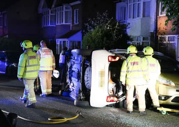 A car overturned in Pavilion Road, Worthing in the early hours of this morning. Picture: Eddie Mitchell