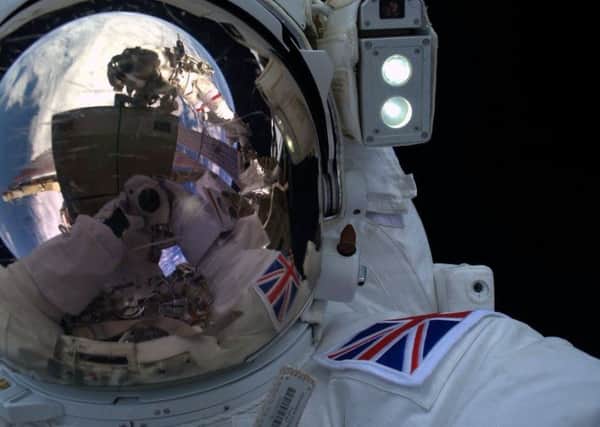 Tim Peake's 'selfie' during his space walk SUS-160116-103659001
