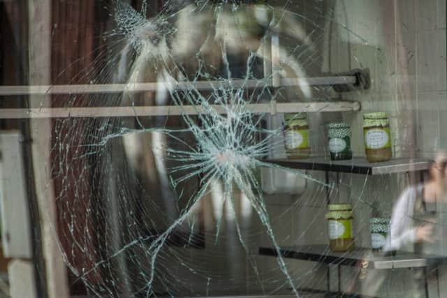 The window of Moran Bros. in Montague Street, Worthing has been smashed. Picture: Peter Pollack  www.filmonfilm.uk