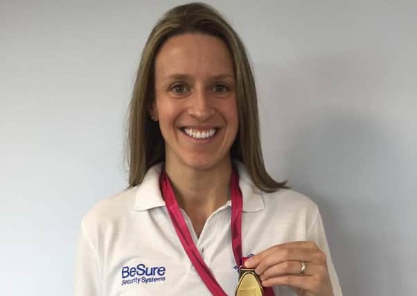 Hastings Seagull Swimming Club talent Hannah Keen with the gold medal she won at the European Masters Championships