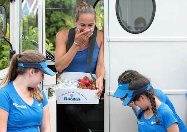 Monica Puig enjoys a laugh wih the ball girls in the ice cream truck - picture: Lydia Redman