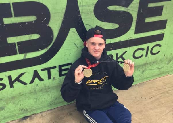 Jordan Clarke with his two world champions medals, at his home skate park The Base in Bognor