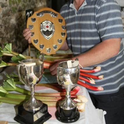 John Millam won three trophies for his produce DM16126641a