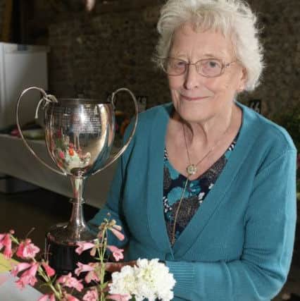 Mary Millam won the cup for most points, flowers DM16126647a