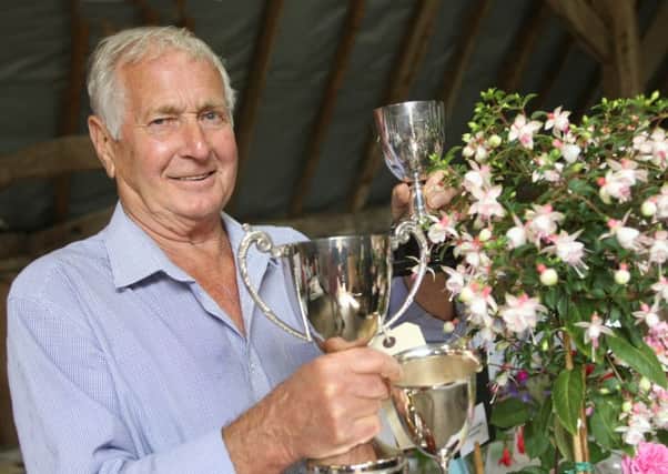 Peter Mazillius won three trophies for his sweet peas and fuchsias. Pictures: Derek Martin DM16126628a