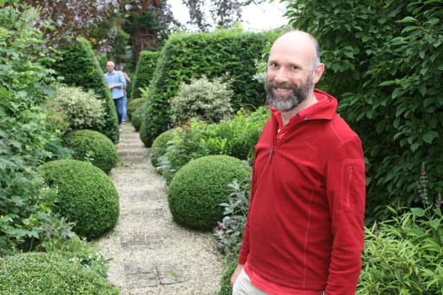 DM16127161a.jpg Petworth secret gardens open for charity. Matthew Spriggs in his garden. Photo by Derek Martin SUS-160626-202158008