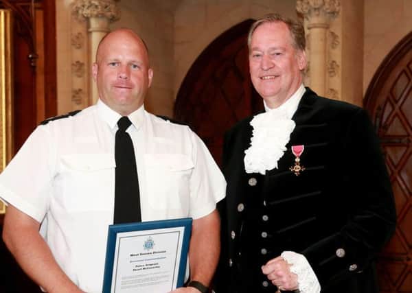 Sergeant Stuart McConachie with the high sheriff of West Sussex