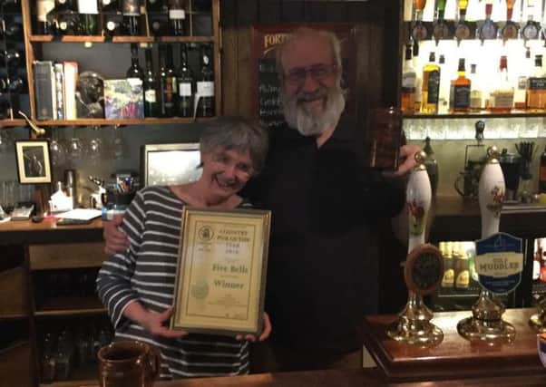 Bill and Joan from the Five Bells pub in West Chiltington with their award J3JU4GRi-9k0ZJ_eOAPj