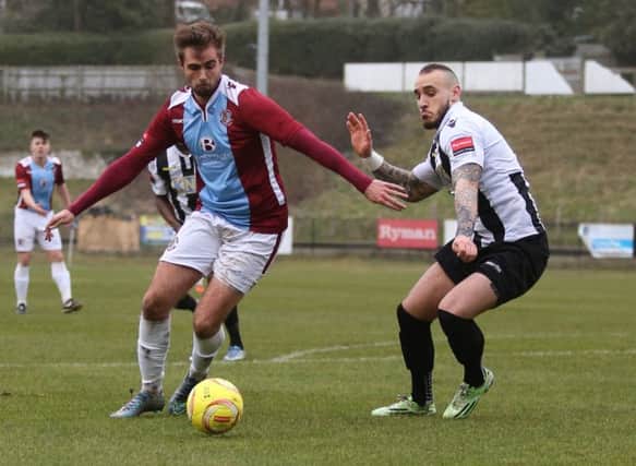 Zac Attwood on the ball for Hastings United against Tooting & Mitcham United last season. Picture courtesy Scott White