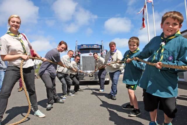 Members of Adur Valley District Scouts pulled a lorry along Worthing's promenade for charity. Pictures: Derek Martin