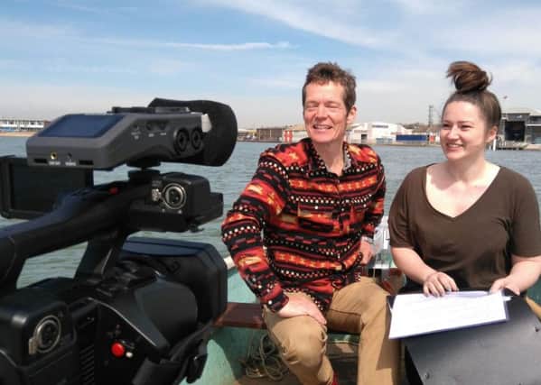 Jon Potter and Rhiannon Barker (presenters of Adur Voluntary Action's new film portrait of the area) filming on the River Adur.
