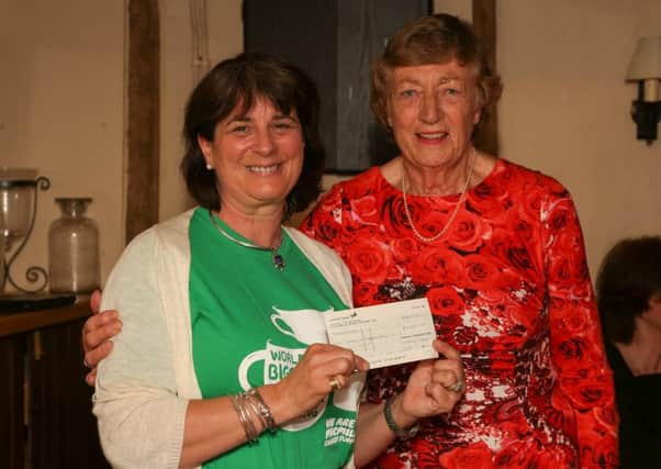 Organiser Joan Langmead, right, presents Â£5,000 to Macmillan Cancer Support in Midhurst