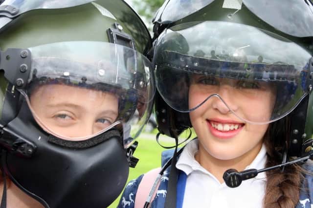 DM16127576a.jpg The Big Bang Fair South East. Meih Such left and Holly Kisby both aged 11 wearing helicopter pilot's helmets. Photo by Derek Martin SUS-160630-200745008