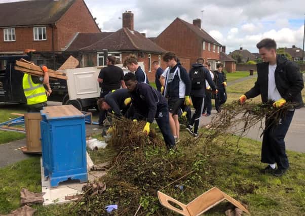Volunteers help tidy up the Whyke estate as part of the community action day.